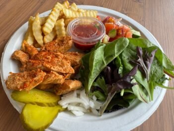 Tandoori chicken platter with French fries, East salad, fresh greens, onions, and pickles at Pita Plus Grill St. Louis